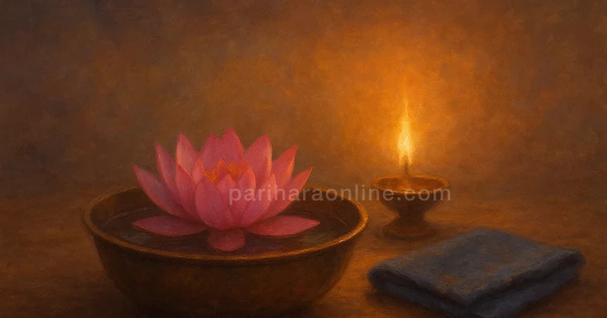 Pink lotus in a brass bowl beside a lit sesame lamp, the enduring symbol of Anuradha nakshatra | pariharaonline.com