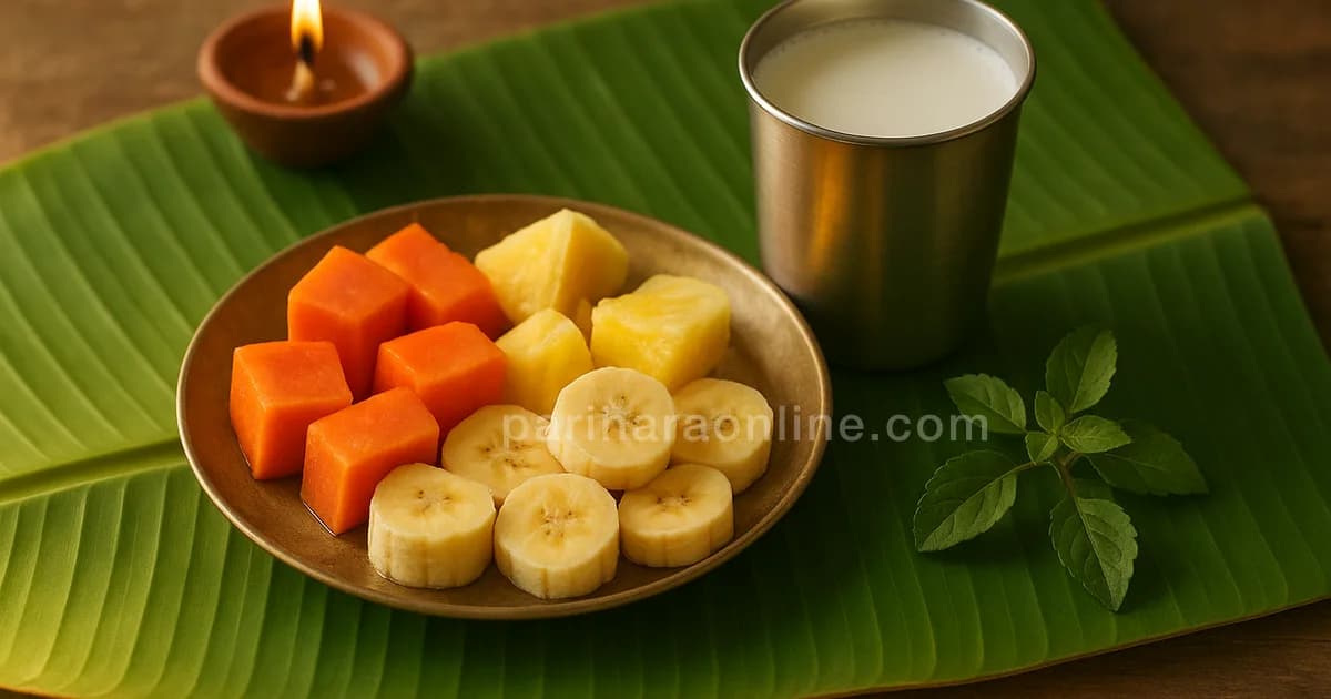 Fasting plate of cut fruit, a tumbler of milk and a tulsi sprig beside a small lit lamp — ekadashi fasting rules | pariharaonline.com
