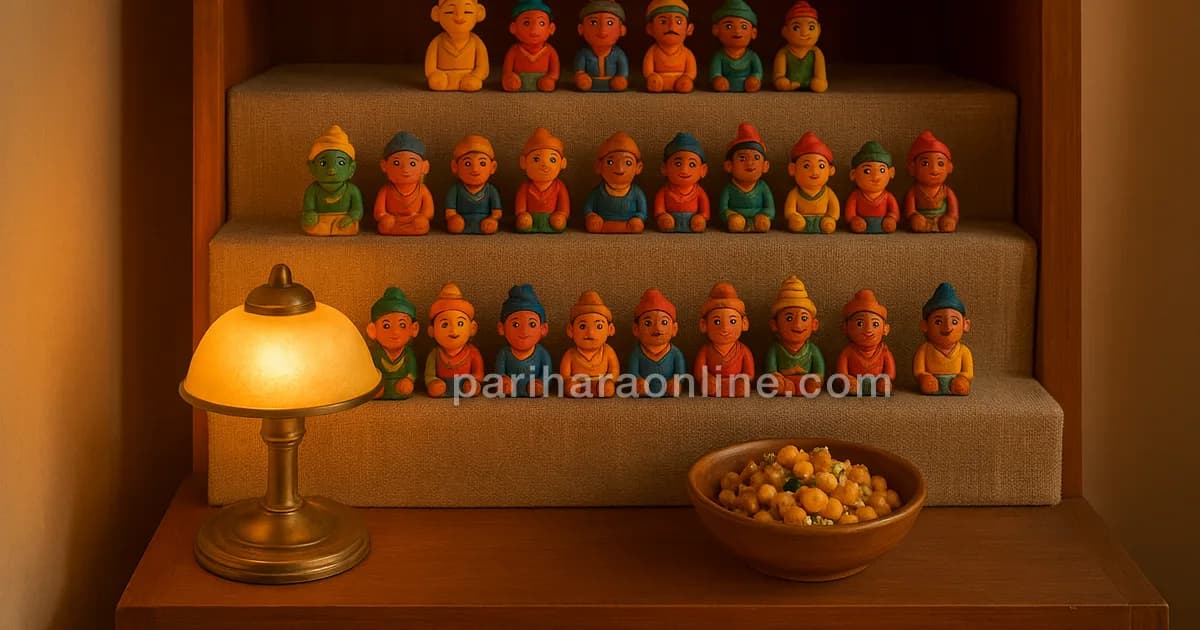 A three-step Golu of colourful clay dolls on a bookshelf with a lit brass lamp — navratri golu at home | pariharaonline.com