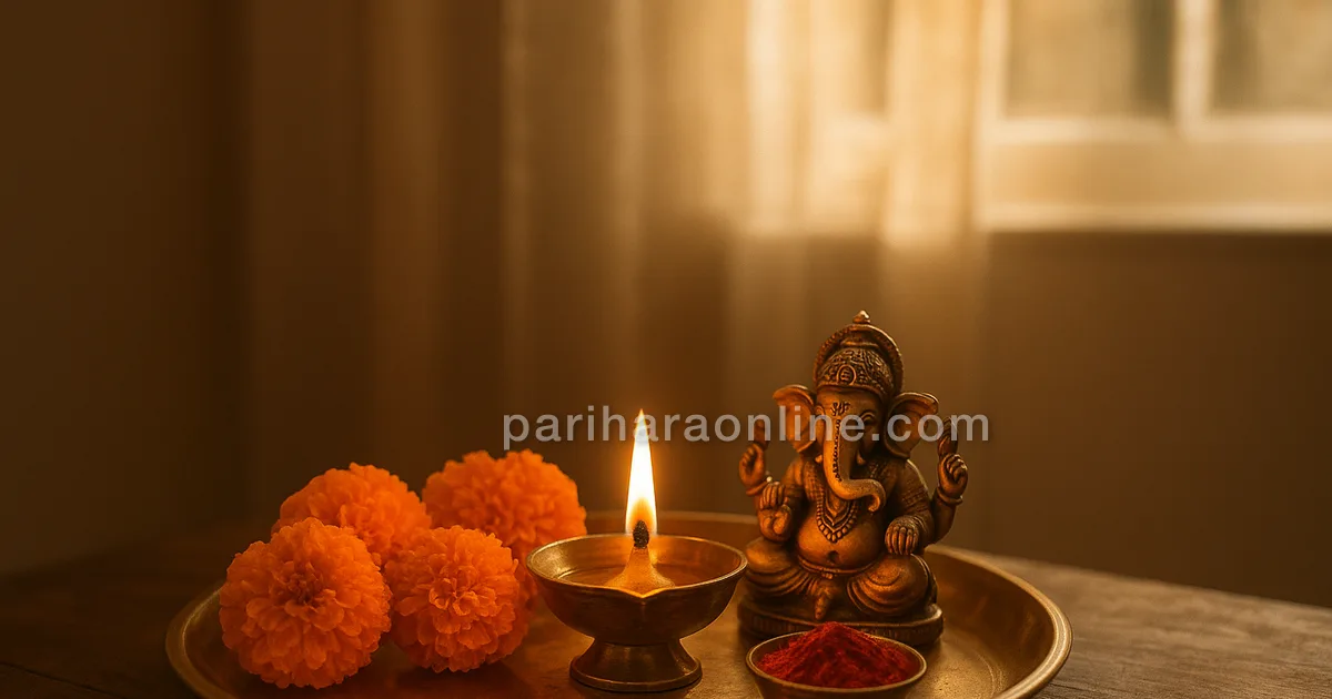 A brass puja thali with a lit lamp, marigolds and a small Ganesha idol in morning light | pariharaonline.com