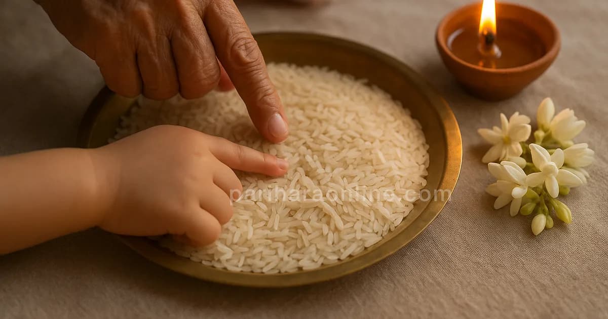 Elder's hand guiding a child's finger to trace a letter in a brass plate of rice beside a lamp — vidyarambham | pariharaonline.com