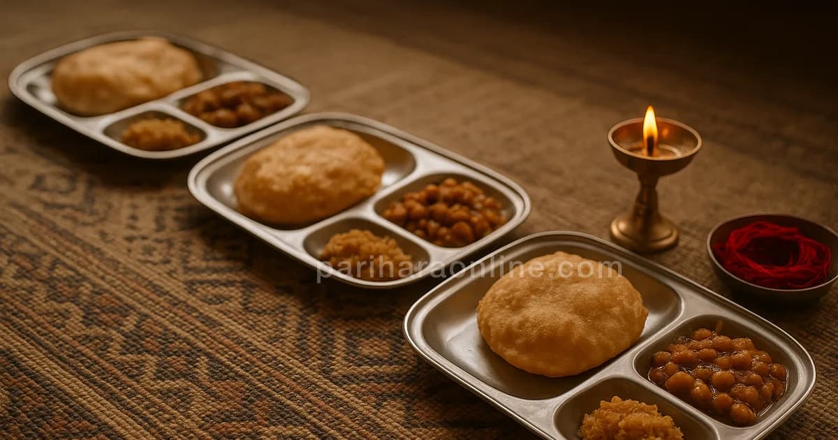 Row of steel plates with halwa, puri and chana on a floor mat beside a brass lamp and red threads — kanya puja meaning | pariharaonline.com