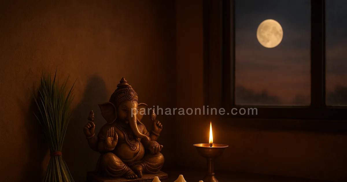 Plate of modakas and durva grass beside a lit lamp, a rising moon visible through the window — sankatahara chaturthi | pariharaonline.com